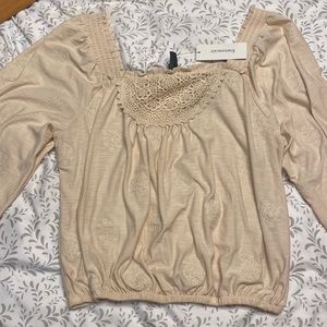 Size medium. Cream color. Never worn. Still has tags.